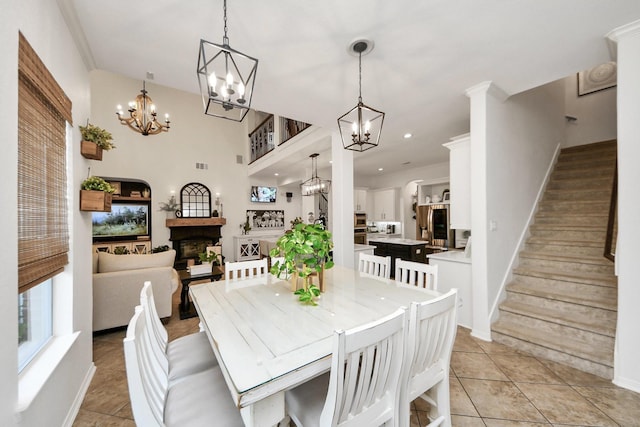 19910 Standing Cypress Dr, Spring, TX 77379 - dining room featuring a chandelier, stairway, a fireplace, and light tile patterned flooring