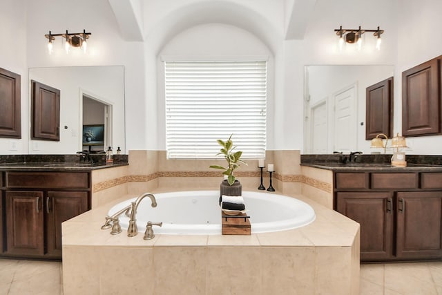 19910 Standing Cypress Dr, Spring, TX 77379 - bathroom featuring tile patterned floors, two vanities, and a jetted tub