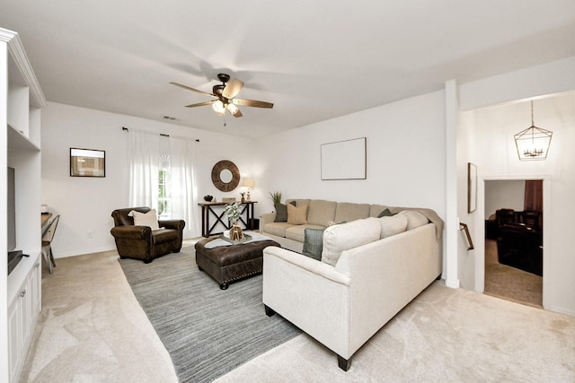 19910 Standing Cypress Dr, Spring, TX 77379 - living area featuring light carpet, a ceiling fan, and a chandelier