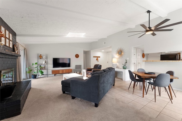 3531 Acorn Springs Ln, Spring, TX 77389 - tiled living room featuring a ceiling fan, a fireplace, and carpet
