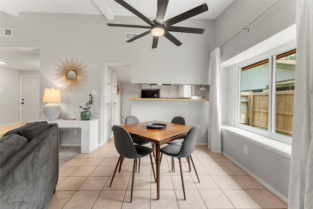 3531 Acorn Springs Ln, Spring, TX 77389 - dining room with light tile patterned floors, a ceiling fan, plenty of natural light, beamed ceiling, and a towering ceiling