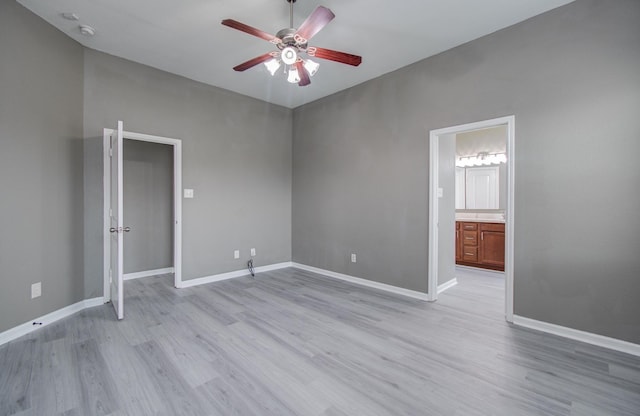15303 Arnold, Baytown, TX 77523 - unfurnished bedroom with light wood-style flooring, baseboards, ceiling fan, and ensuite bath