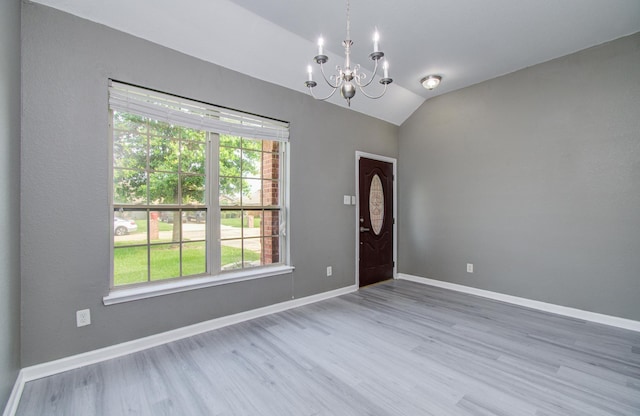 15303 Arnold, Baytown, TX 77523 - entryway featuring a chandelier, wood finished floors, healthy amount of natural light, lofted ceiling, and baseboards