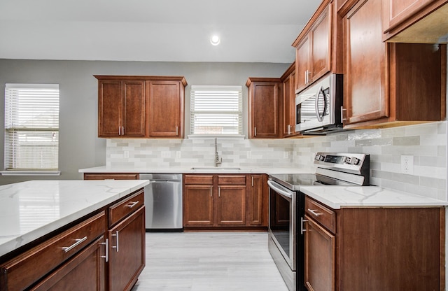 15303 Arnold, Baytown, TX 77523 - kitchen featuring stainless steel appliances, a sink, healthy amount of natural light, tasteful backsplash, and recessed lighting