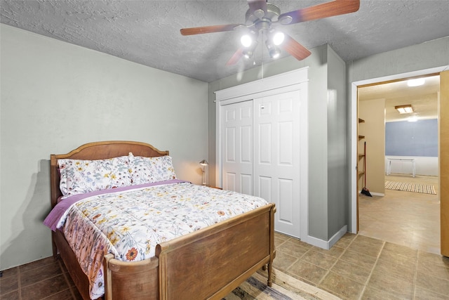 25 Willey Rd, Bedias, TX 77831 - tiled bedroom featuring a textured ceiling, a closet, and ceiling fan