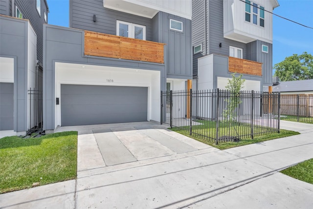 1616 Euel St, Houston, TX 77009 - contemporary home featuring board and batten siding, a garage, and driveway