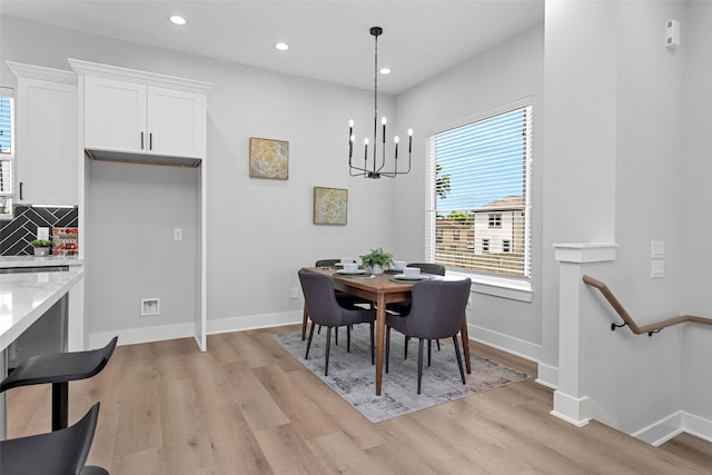 1616 Euel St, Houston, TX 77009 - dining area featuring light wood finished floors, baseboards, recessed lighting, and a chandelier