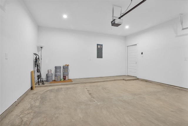 1616 Euel St, Houston, TX 77009 - garage featuring electric panel, a garage door opener, and recessed lighting