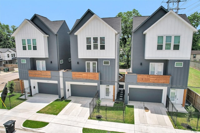 1616 Euel St, Houston, TX 77009 - view of front of property featuring french doors, driveway, board and batten siding, and an attached garage