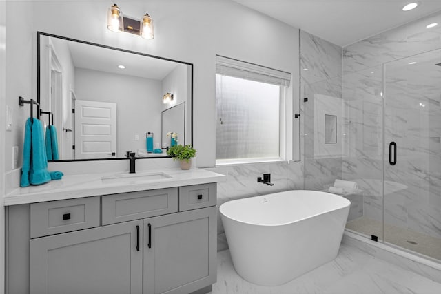 1616 Euel St, Houston, TX 77009 - bathroom featuring a freestanding bath, vanity, a marble finish shower, marble finish floors, and recessed lighting