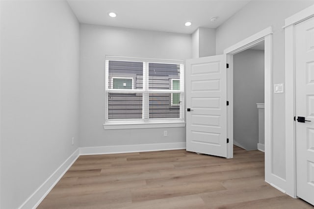 1616 Euel St, Houston, TX 77009 - empty room featuring light wood finished floors, recessed lighting, baseboards, and a smoke detector