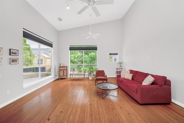 668 Lester St, Houston, TX 77007 - living area featuring high vaulted ceiling, ceiling fan, light wood-style floors, and baseboards