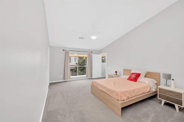 668 Lester St, Houston, TX 77007 - carpeted bedroom featuring vaulted ceiling and baseboards