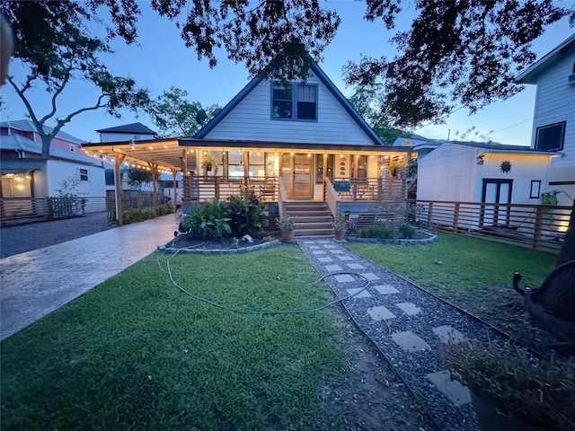 210 Queen Rd, Clear Lake Shores, TX 77565 - view of front facade with driveway, a porch, and a carport