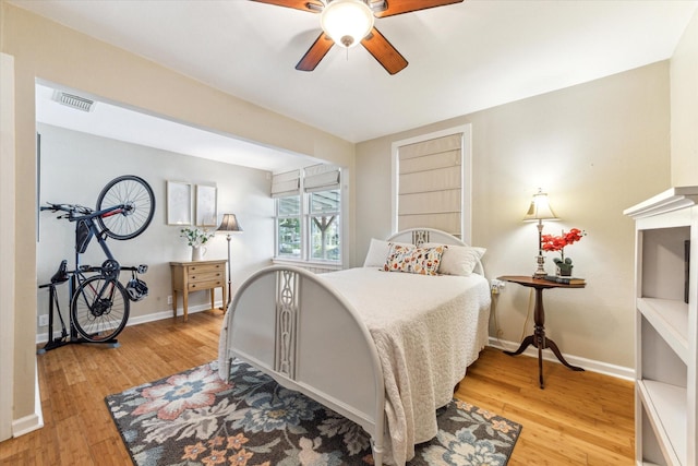 210 Queen Rd, Clear Lake Shores, TX 77565 - bedroom featuring light wood-style floors, baseboards, and ceiling fan