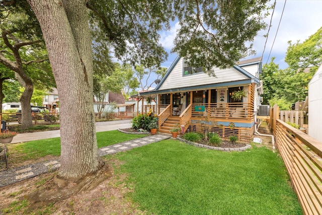 210 Queen Rd, Clear Lake Shores, TX 77565 - bungalow-style home featuring covered porch and central AC unit