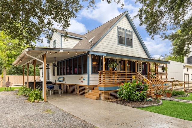 210 Queen Rd, Clear Lake Shores, TX 77565 - view of front of house featuring covered porch and a shingled roof
