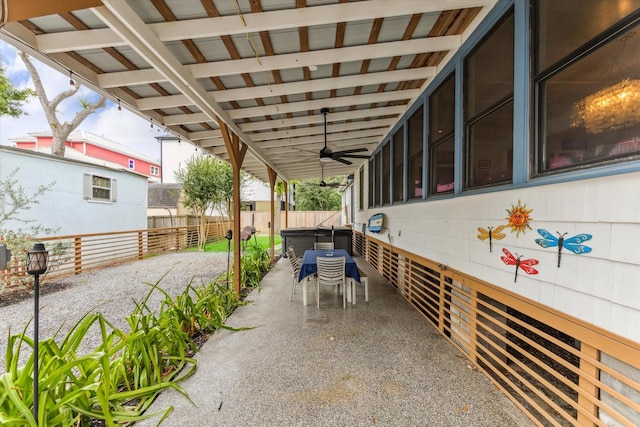 210 Queen Rd, Clear Lake Shores, TX 77565 - fenced backyard with ceiling fan, a hot tub, and a patio area