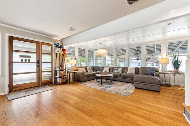 210 Queen Rd, Clear Lake Shores, TX 77565 - living area featuring light wood-style floors and ornamental molding