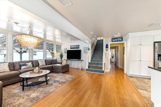 210 Queen Rd, Clear Lake Shores, TX 77565 - living area with stairway, a chandelier, light wood-style flooring, recessed lighting, and baseboards