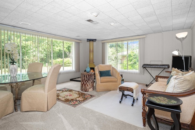 111 Ann St, Crockett, TX 75835 - carpeted living area featuring plenty of natural light