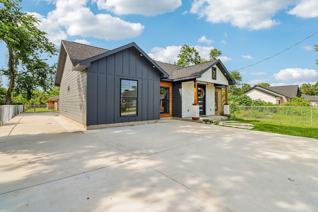 16731 Water Oak Dr, Channelview, TX 77530 - view of front of property featuring board and batten siding, concrete driveway, and roof with shingles