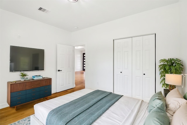 16731 Water Oak Dr, Channelview, TX 77530 - bedroom with light wood finished floors and a closet