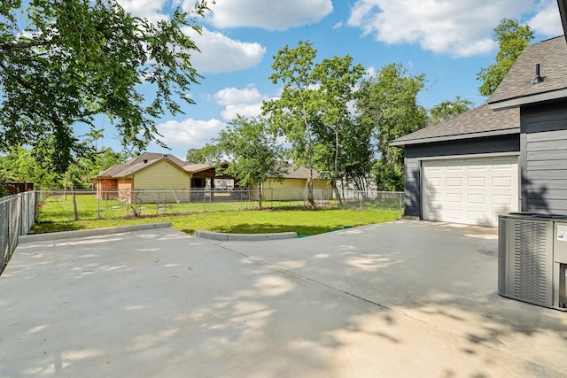 16731 Water Oak Dr, Channelview, TX 77530 - view of yard with concrete driveway and central air condition unit
