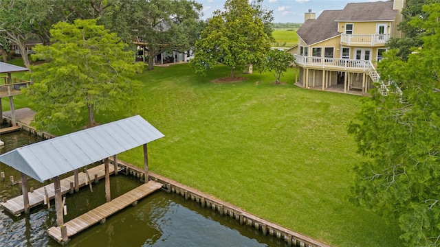287 County Road 416, Brazoria, TX 77422 - dock with a deck with water view, a lawn, and stairs