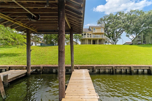 287 County Road 416, Brazoria, TX 77422 - dock area with a water view and a lawn