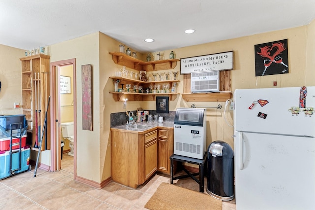 287 County Road 416, Brazoria, TX 77422 - kitchen featuring freestanding refrigerator, open shelves, a sink, light tile patterned floors, and brown cabinets