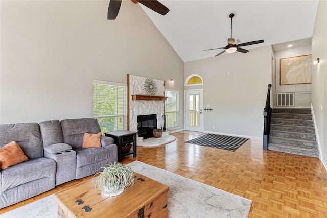 287 County Road 416, Brazoria, TX 77422 - living room featuring a ceiling fan, high vaulted ceiling, baseboards, stairway, and a high end fireplace