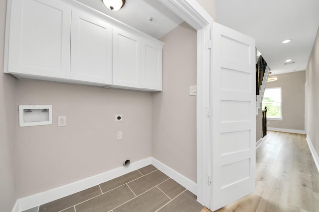 3913 Griggs Rd, Houston, TX 77021 - laundry area featuring cabinet space, hookup for an electric dryer, washer hookup, baseboards, and recessed lighting