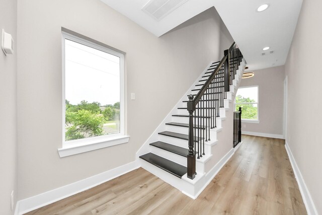 3913 Griggs Rd, Houston, TX 77021 - staircase featuring wood finished floors, baseboards, and recessed lighting