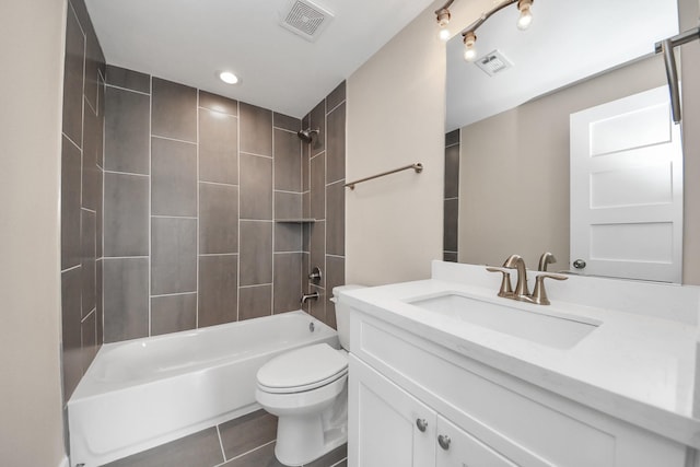 3913 Griggs Rd, Houston, TX 77021 - bathroom with vanity, toilet, washtub / shower combination, tile patterned floors, and recessed lighting