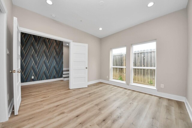 3913 Griggs Rd, Houston, TX 77021 - empty room with wood finished floors, baseboards, and recessed lighting