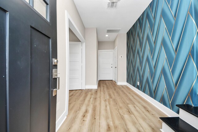 3913 Griggs Rd, Houston, TX 77021 - foyer with baseboards and light wood-style floors