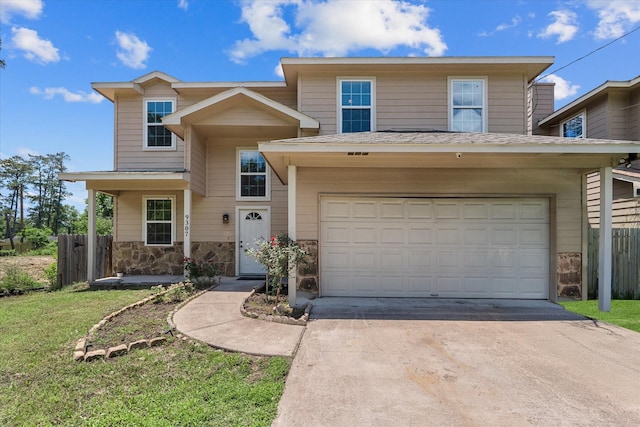 9307 Seeker St, Houston, TX 77028 - traditional home with concrete driveway, a garage, and stone siding