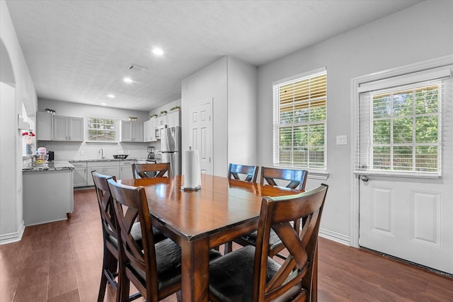 9307 Seeker St, Houston, TX 77028 - dining area featuring dark wood finished floors, recessed lighting, and baseboards
