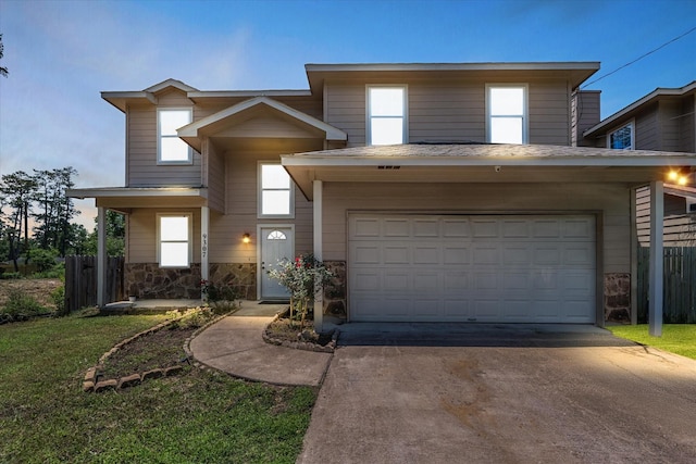 9307 Seeker St, Houston, TX 77028 - traditional-style home with concrete driveway, stone siding, and a garage