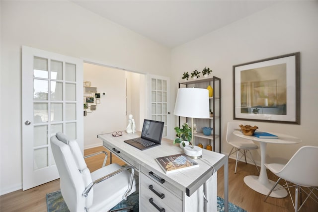 16800 Needlepoint Dr, Conroe, TX 77302 - office area with wood finished floors, baseboards, and french doors