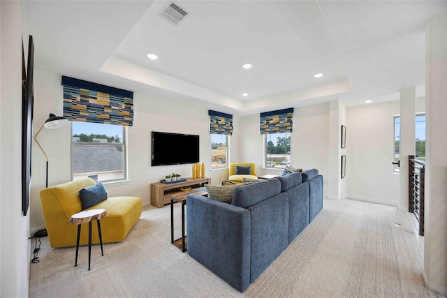 16800 Needlepoint Dr, Conroe, TX 77302 - living room featuring light carpet, plenty of natural light, recessed lighting, baseboards, and a raised ceiling