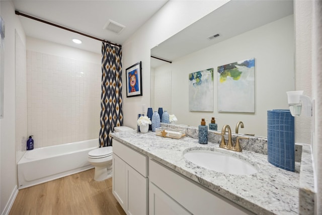 16800 Needlepoint Dr, Conroe, TX 77302 - bathroom with wood finished floors, toilet, vanity, shower / tub combo with curtain, and recessed lighting