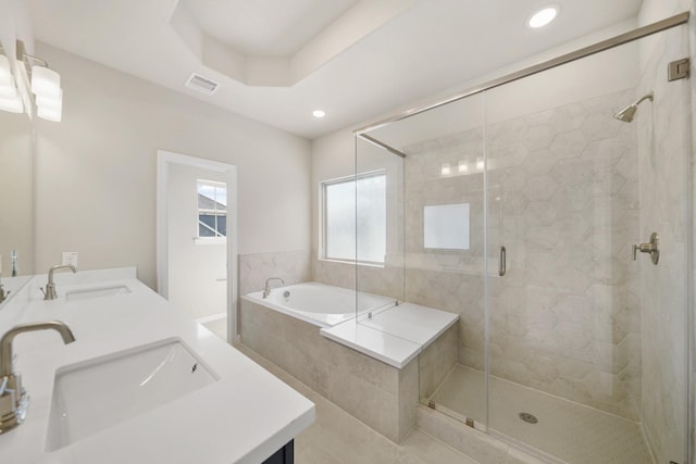 2033 Millbridge Spring Ln, Houston, TX 77051 - bathroom featuring a garden tub, double vanity, a shower stall, recessed lighting, and tile patterned flooring