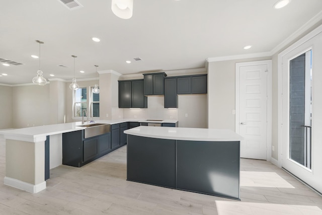 2033 Millbridge Spring Ln, Houston, TX 77051 - kitchen with a sink, crown molding, a kitchen island, recessed lighting, and a peninsula