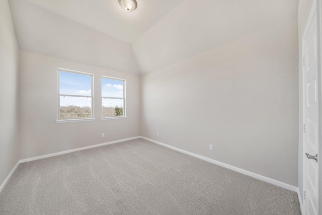 2033 Millbridge Spring Ln, Houston, TX 77051 - spare room featuring baseboards, carpet flooring, and vaulted ceiling