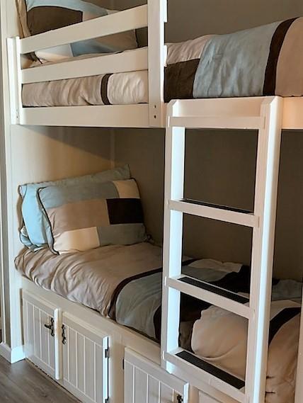 6102 Seawall Blvd Unit 276, Galveston, TX 77551 - bedroom featuring dark wood finished floors