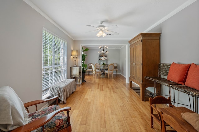 2828 S Logrun Cir, The Woodlands, TX 77380 - living area featuring light wood-style flooring, ornamental molding, and a ceiling fan