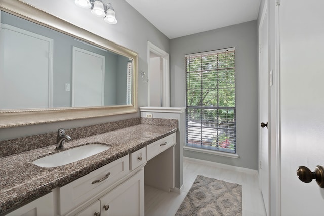 2828 S Logrun Cir, The Woodlands, TX 77380 - bathroom with vanity, healthy amount of natural light, and baseboards