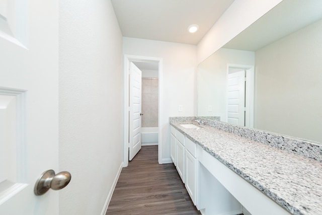13228 Musky Dr, Conroe, TX 77384 - bathroom featuring vanity, wood finished floors, and a tub to relax in
